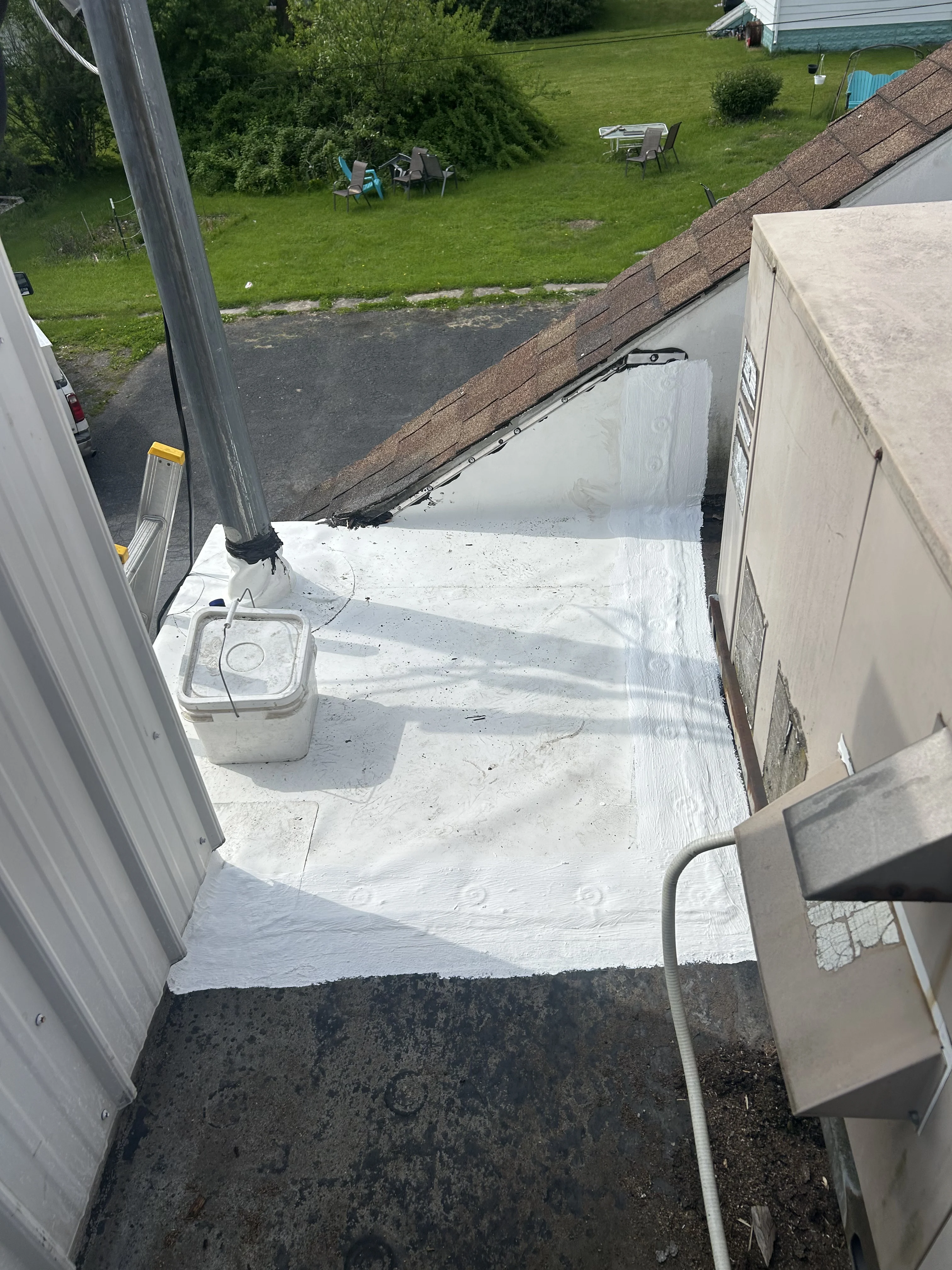 Restored commercial flat roof in Pennsylvania after elastomeric coating application by YZ Construction