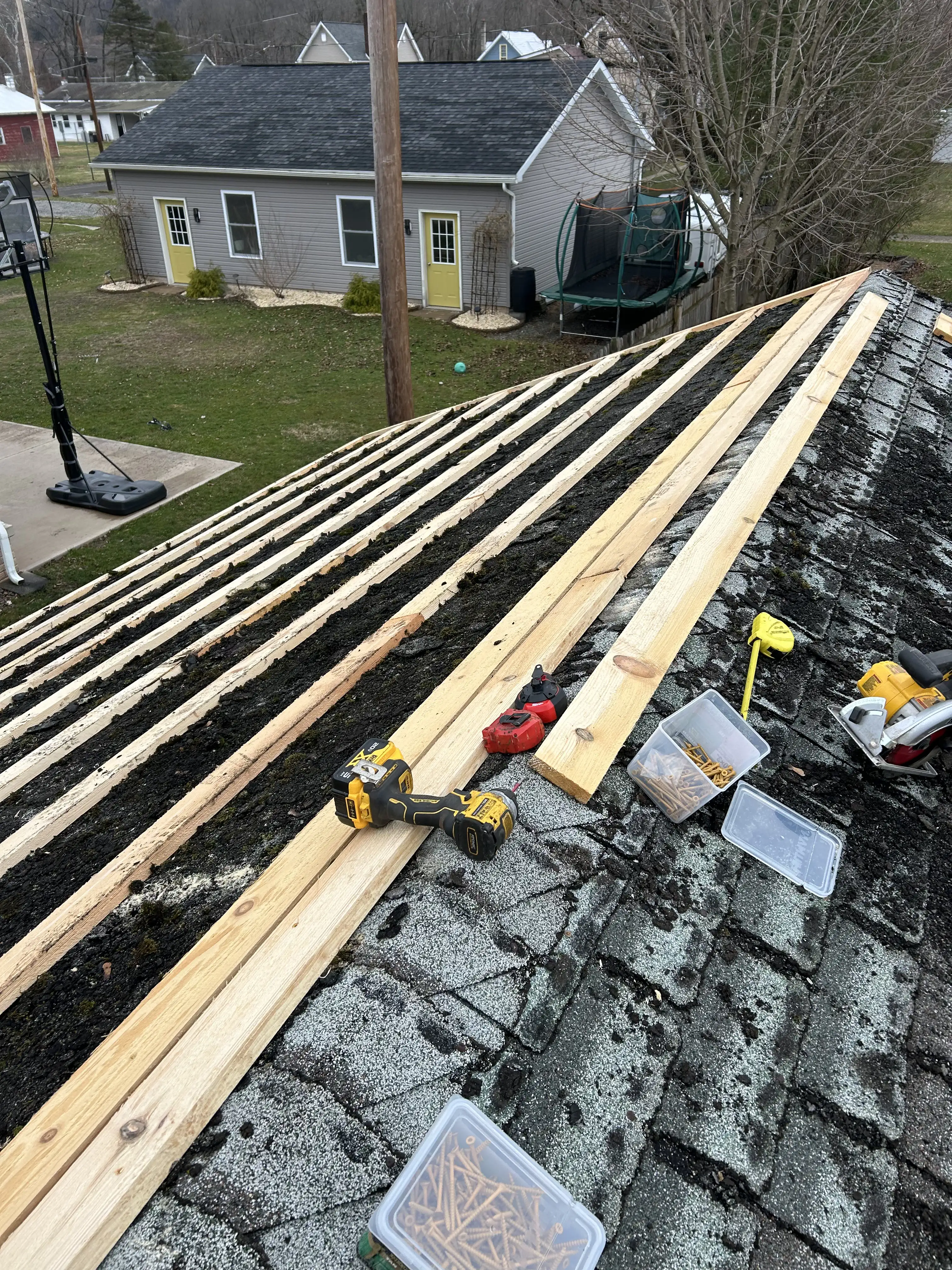 Commercial flat roof in Pennsylvania before coating — faded surface and weathered seams